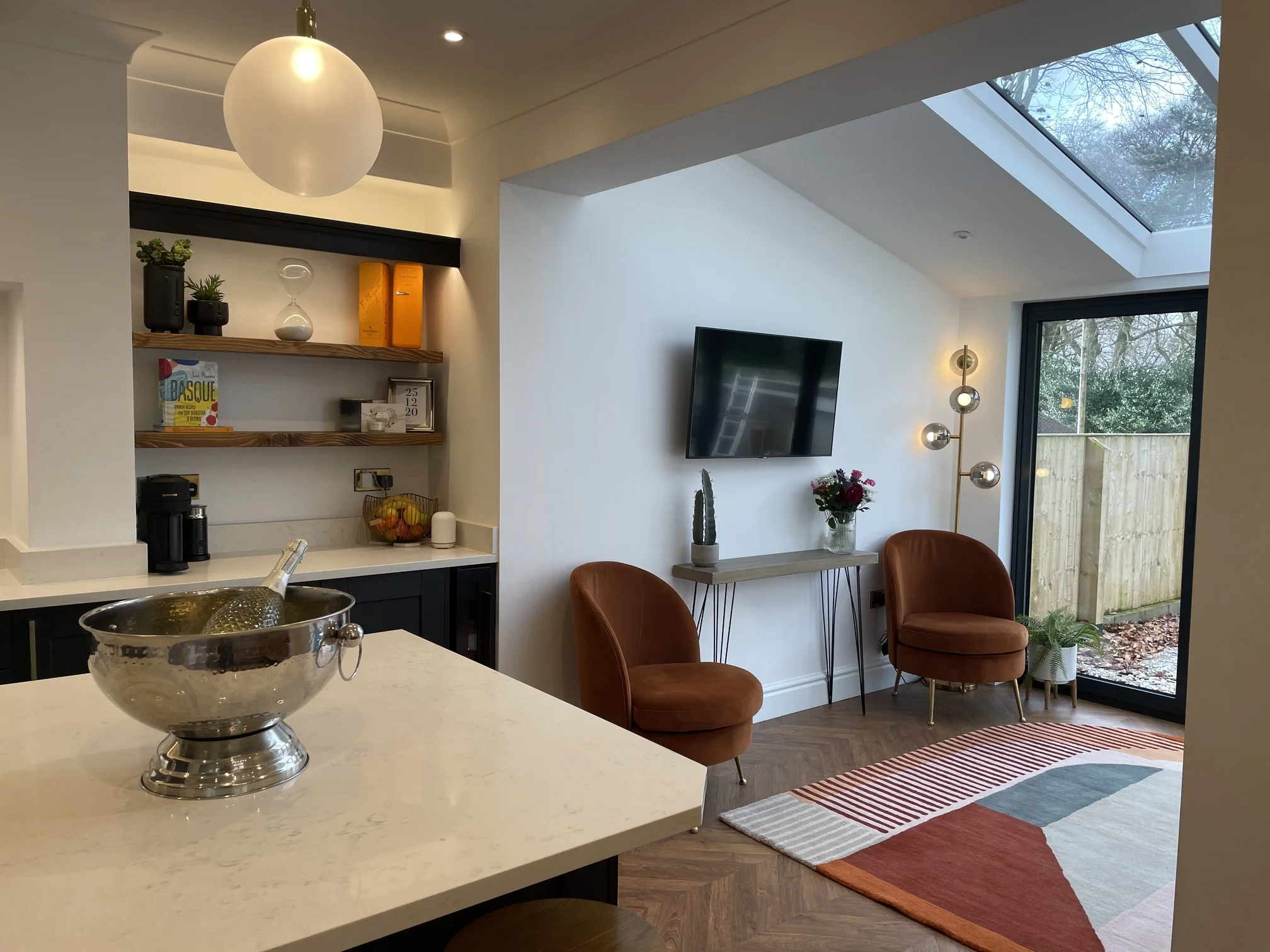Champagne bottle on kitchen counter near house extension