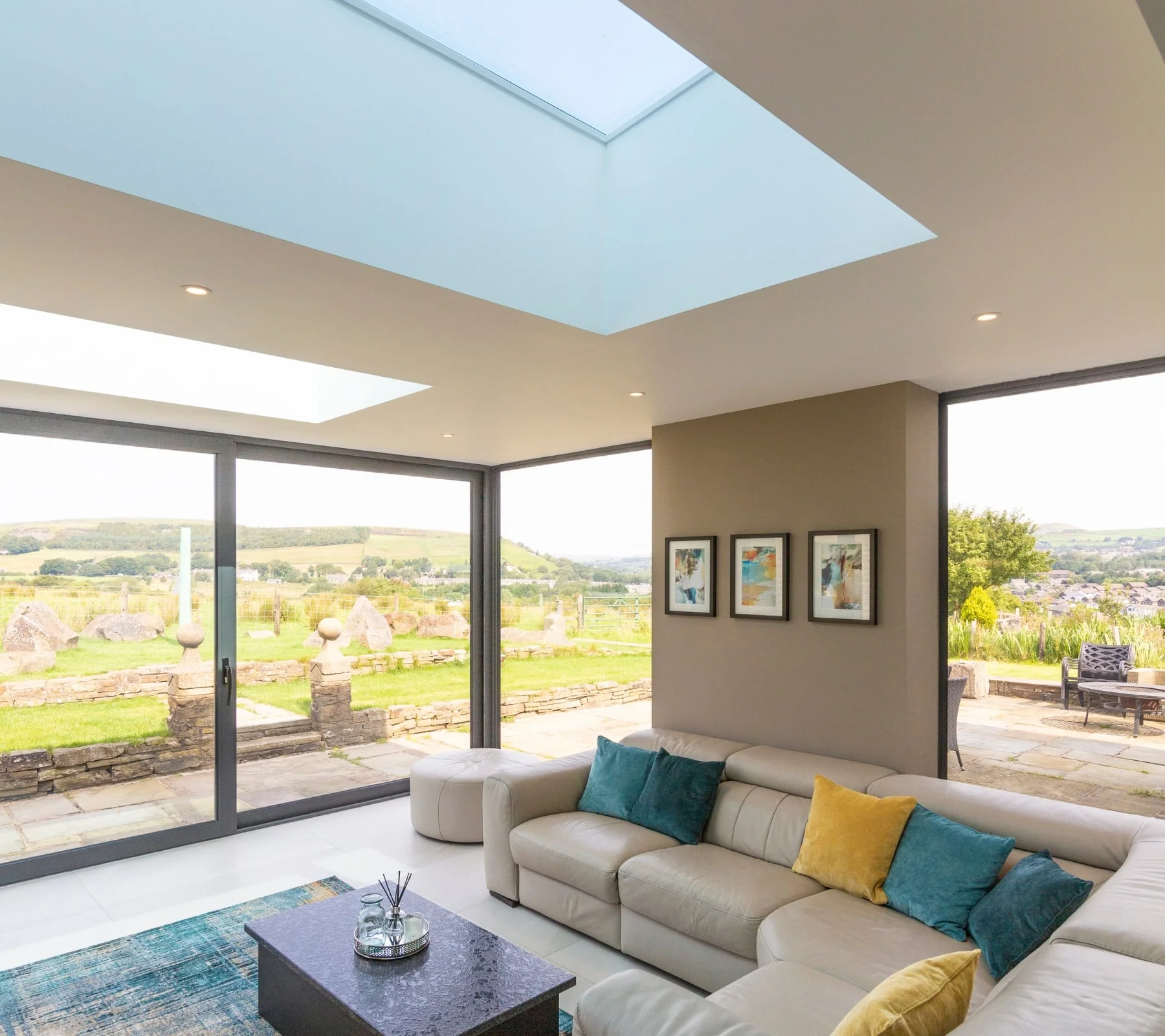 Gorgeous view of English countryside from inside bright and airy home extension with neutral furnishing