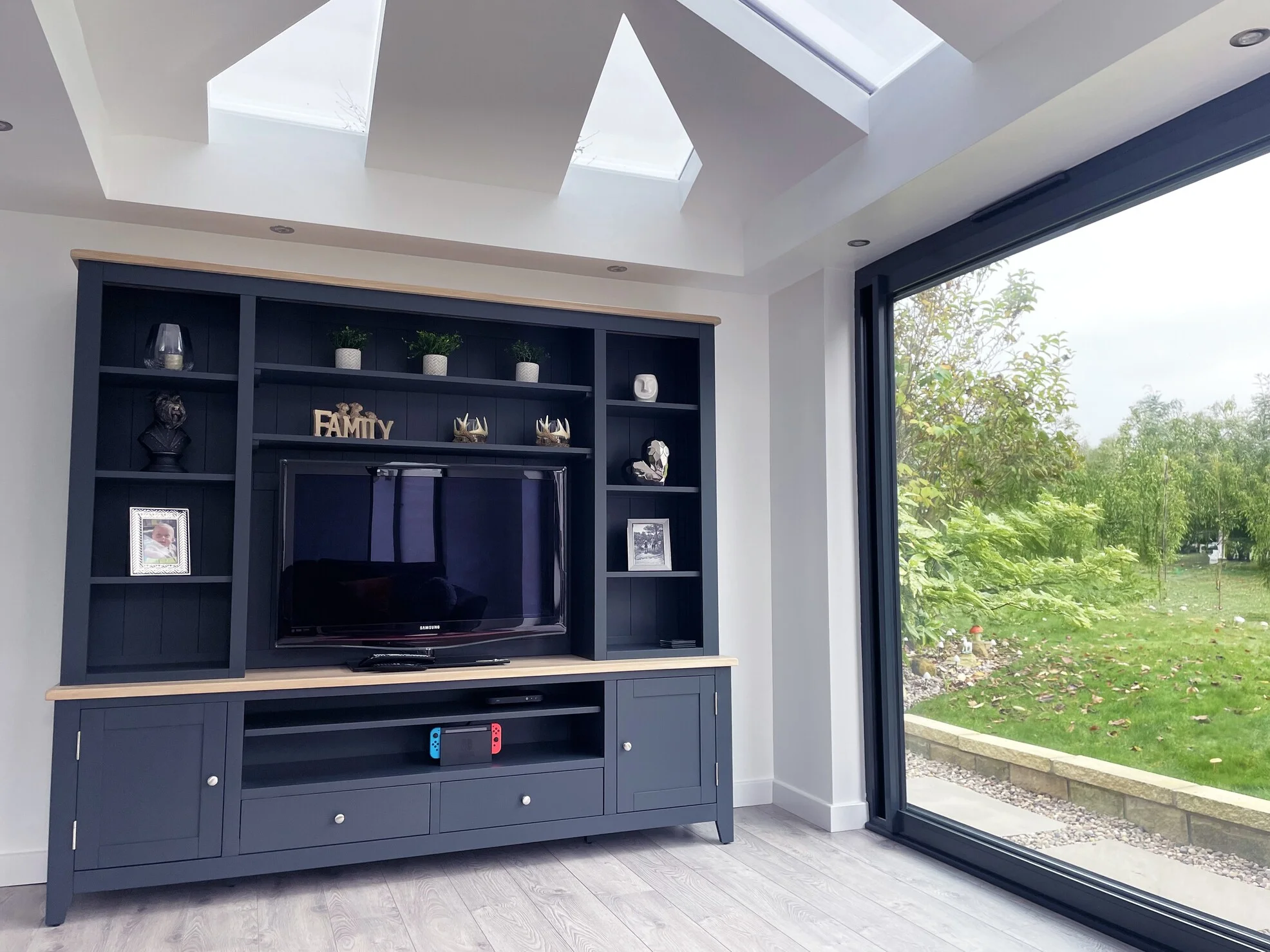 Feature media wall in lounge extension in UK home