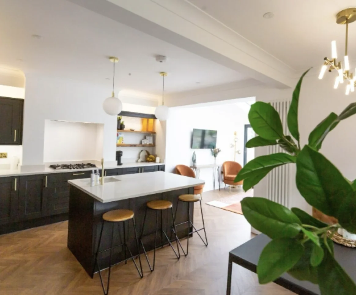 Black and white kitchen with island and breakfast stools