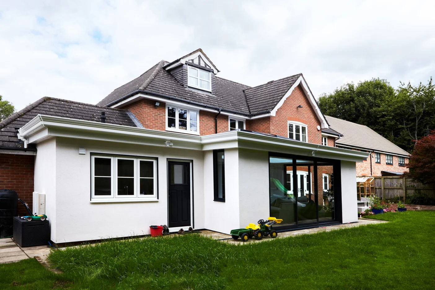 Exterior white render finish of hup! home extension for large British home
