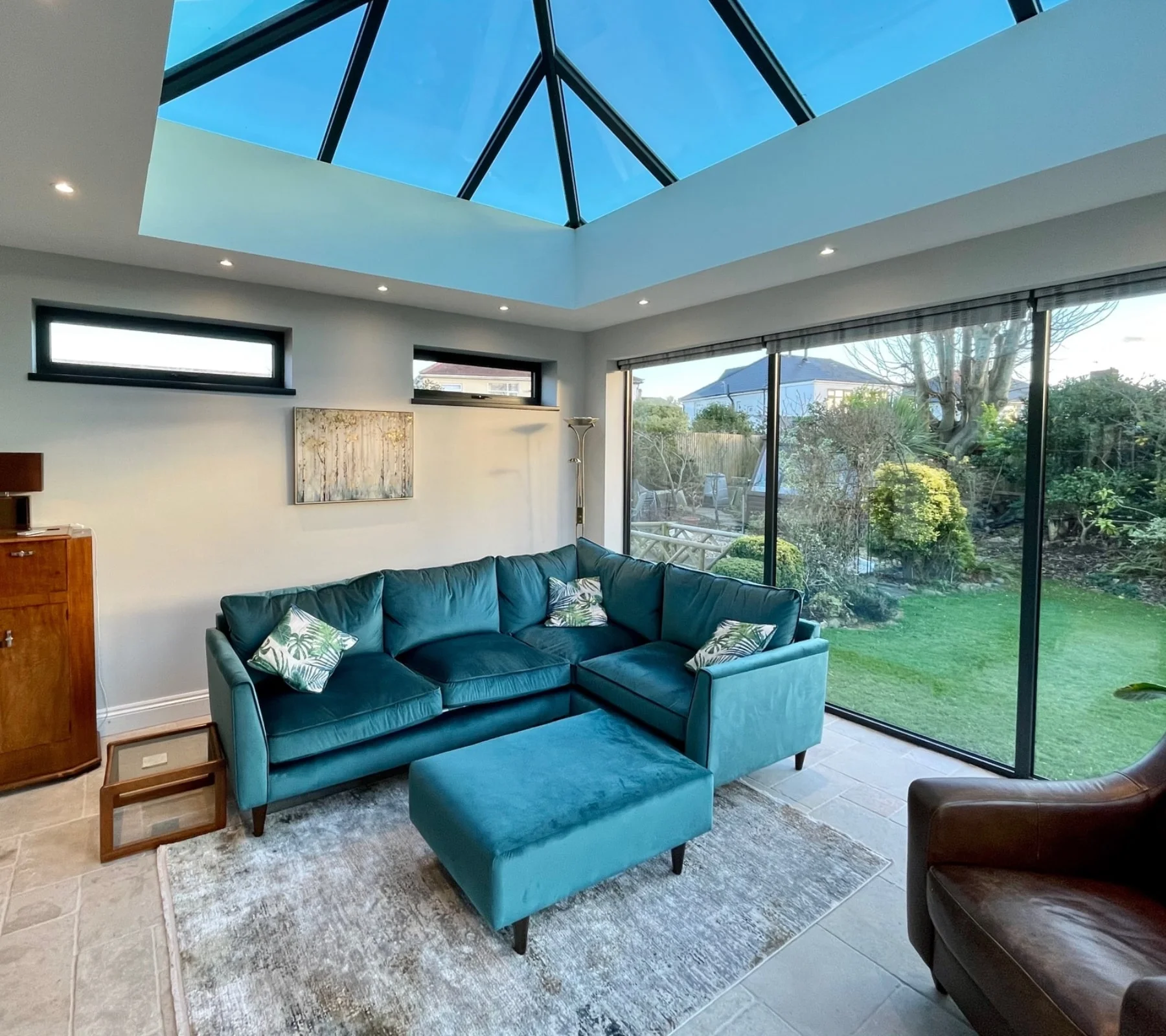 Bright indoor space with blue sofa in new hup! extension build