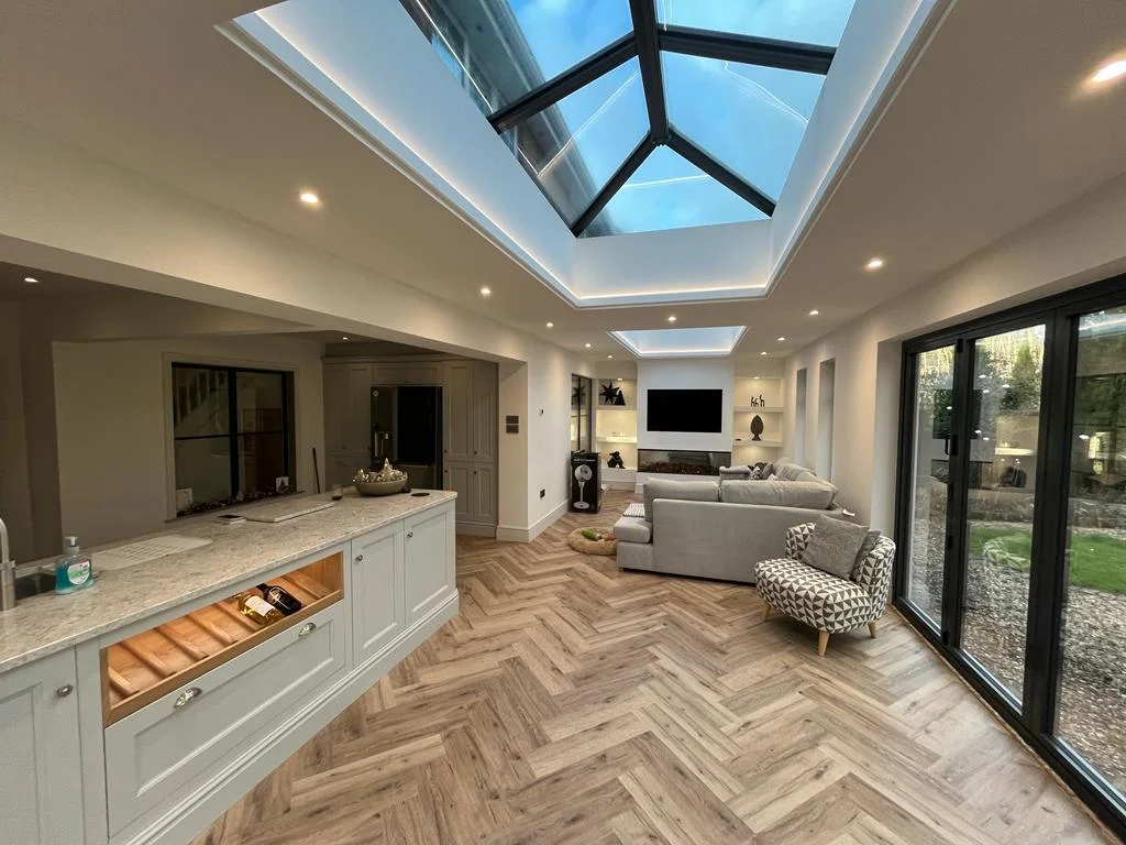 Very large home orangery extension with lantern style glass roof