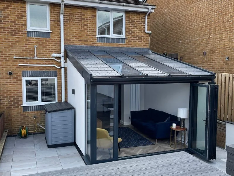 Modernised home extension conversion with glass bi-folding doors