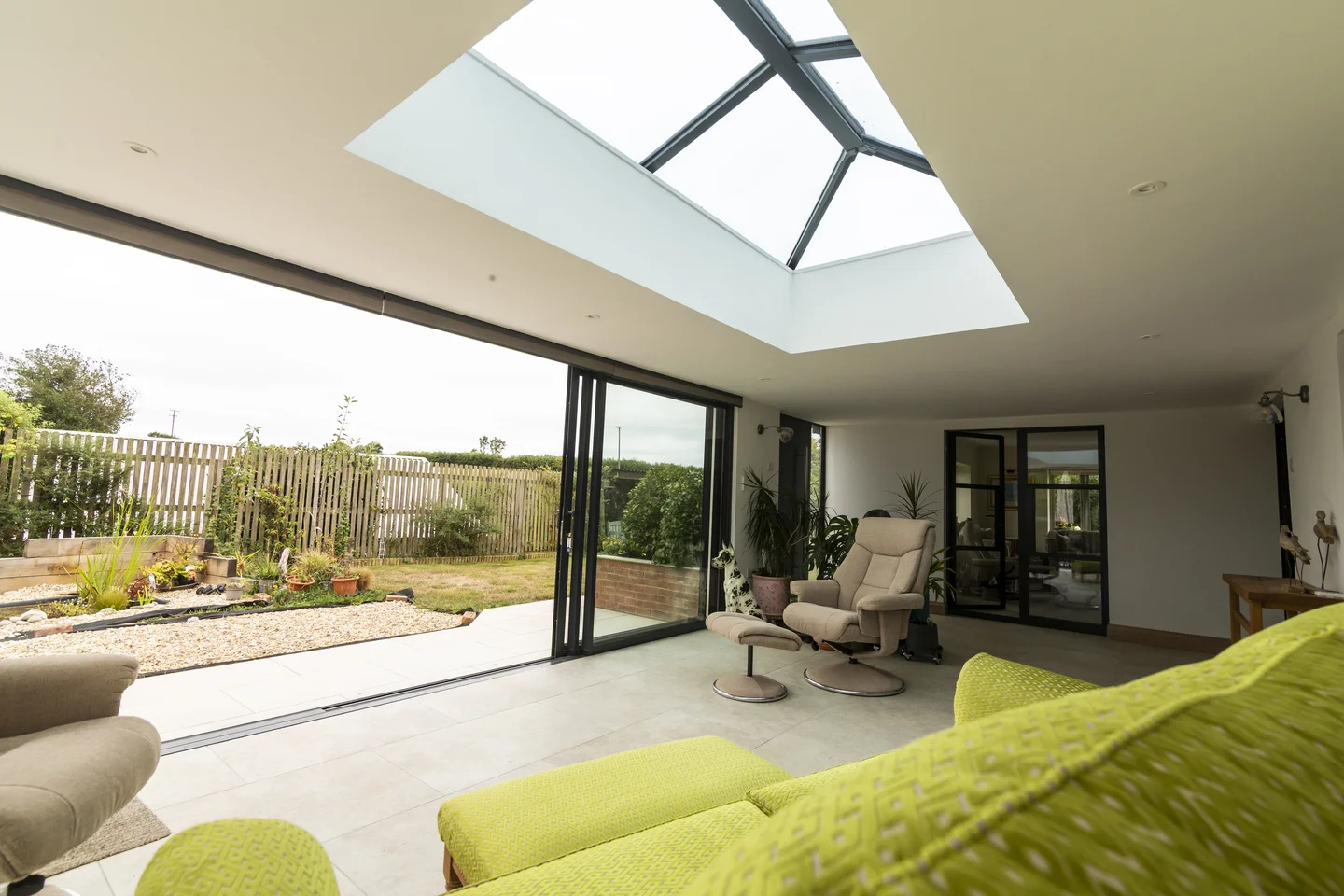 Full width sliding door feature in modern UK home extension