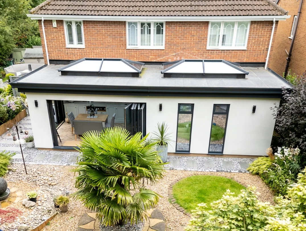 Aerial view of new UK home extension with twin lantern roof