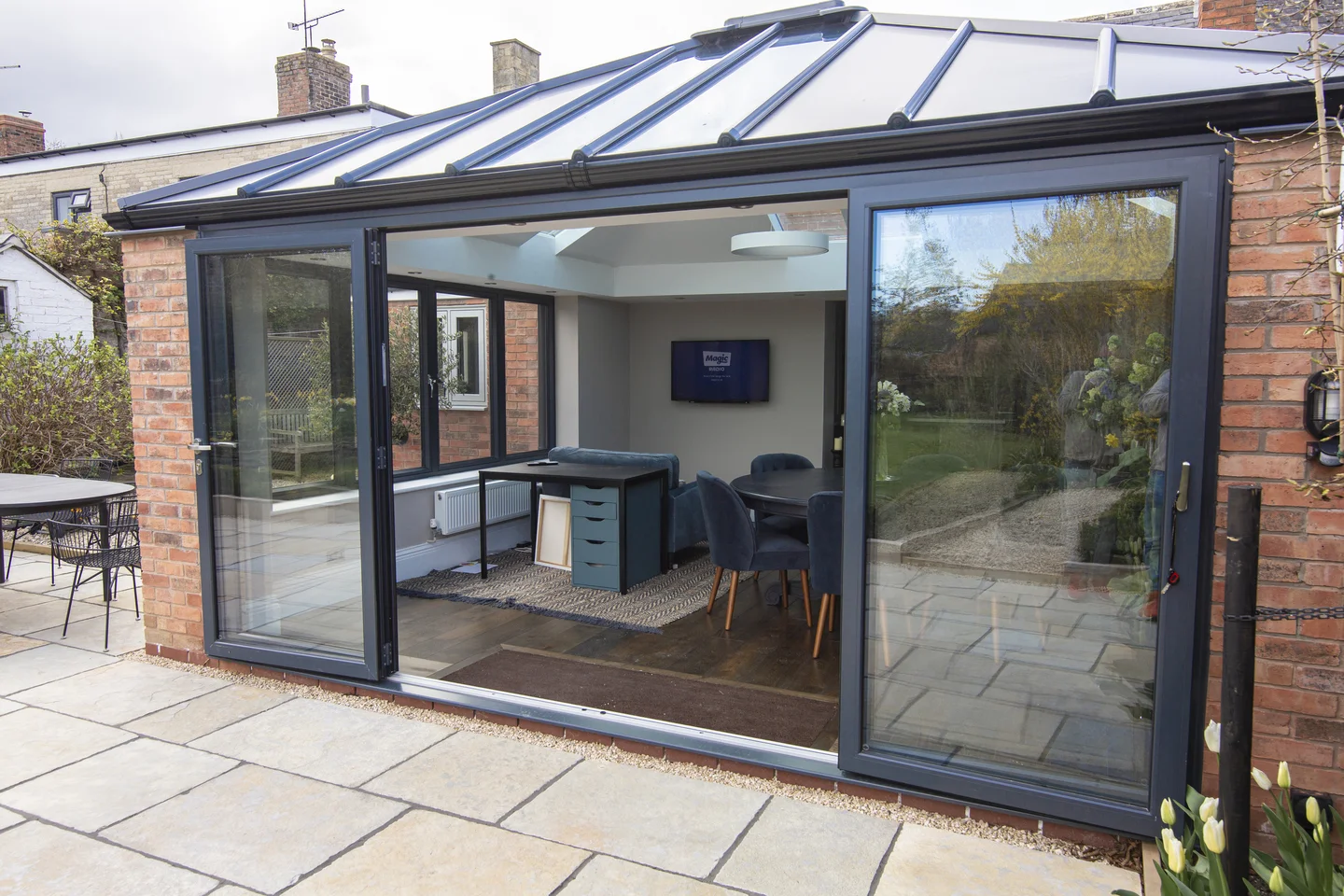 Outside view of brick finish home extension with tiled roof